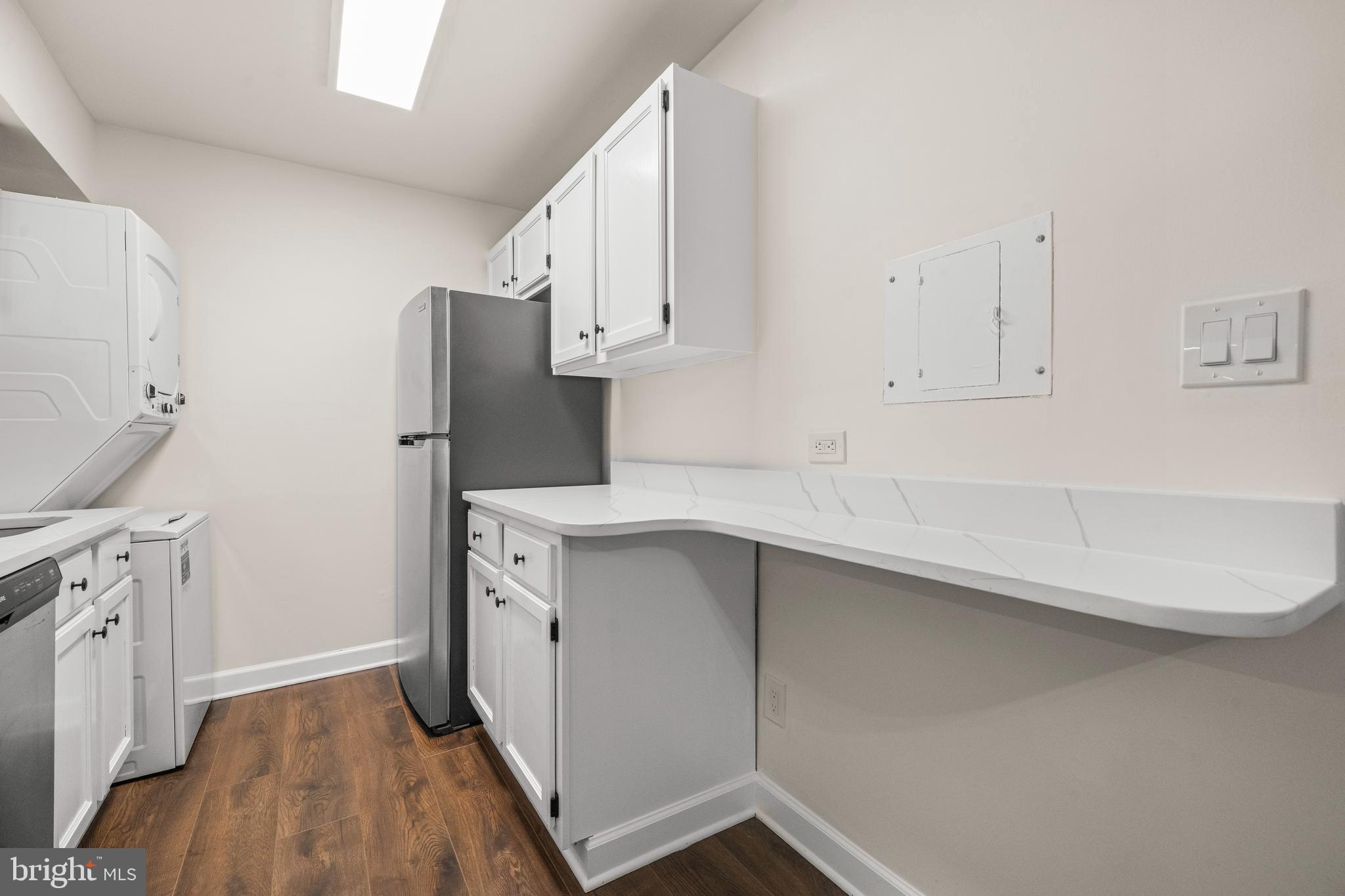 1134 South Washington Street, Unit T1 Falls Church, VA 22046 - Photo 13 of 34 a kitchen with cabinets and a stainless steel appliances