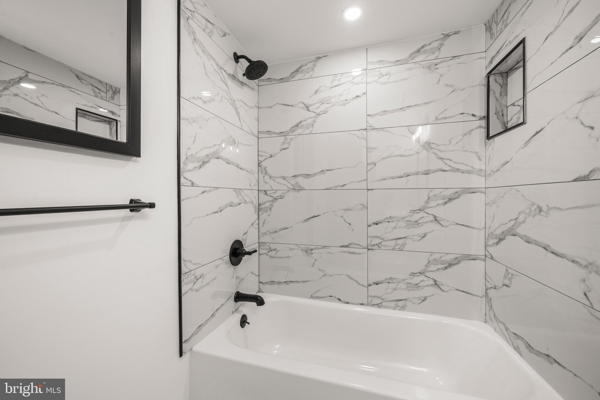 1134 South Washington Street, Unit T1 Falls Church, VA 22046 - Photo 19 of 34 a bathroom with a bathtub