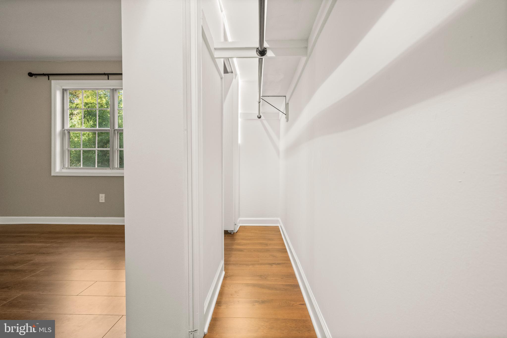 1134 South Washington Street, Unit T1 Falls Church, VA 22046 - Photo 24 of 34 a view of a hallway with white walls and a window