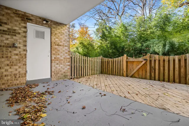 a white house with wooden fence
