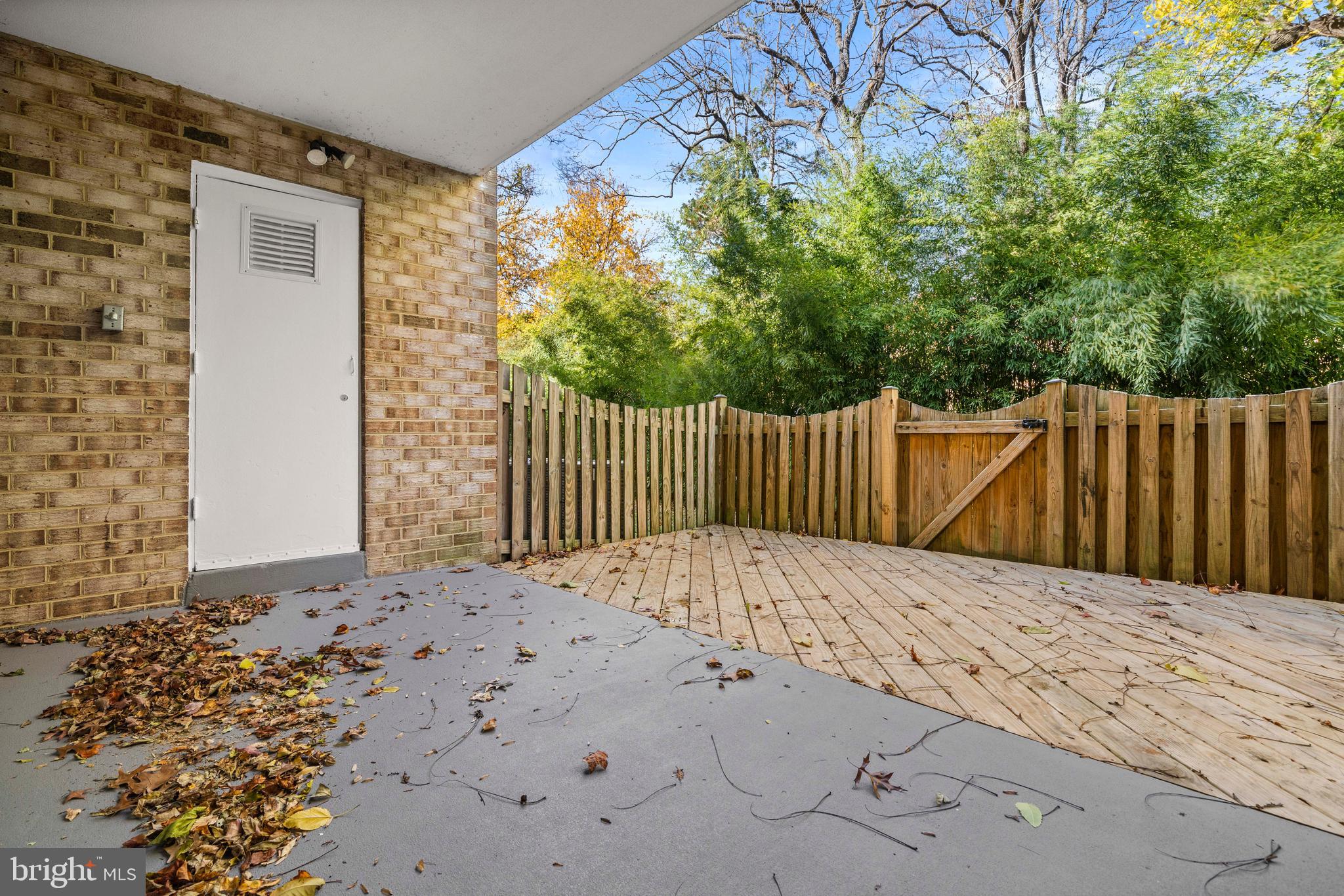 1134 South Washington Street, Unit T1 Falls Church, VA 22046 - Photo 26 of 34 a white house with wooden fence