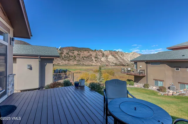a view of a chairs and table in the patio