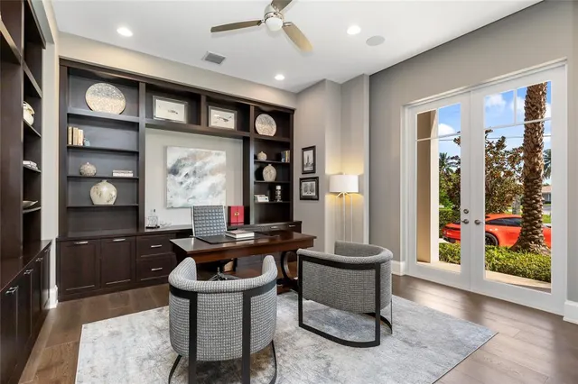 a view of a hallway with an entryway and livingroom view