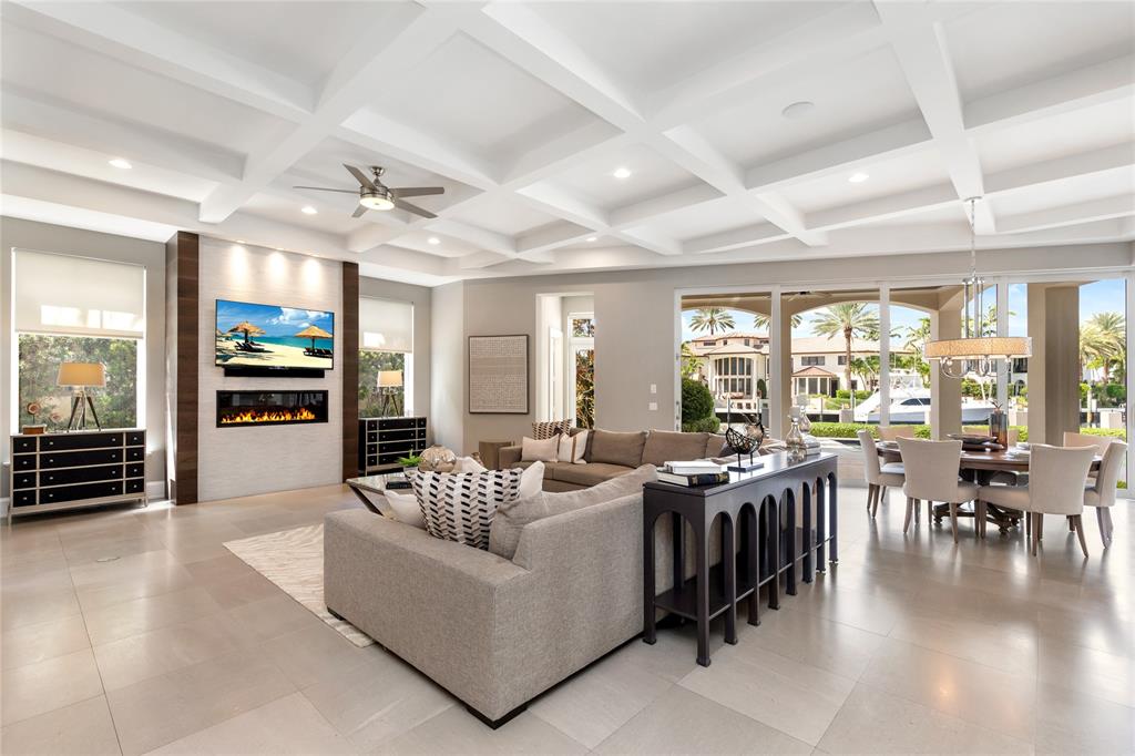 3211 Northeast 27th Avenue Lighthouse Point, FL 33064 - Photo 30 of 98 a living room with furniture floor to ceiling window and flat screen tv