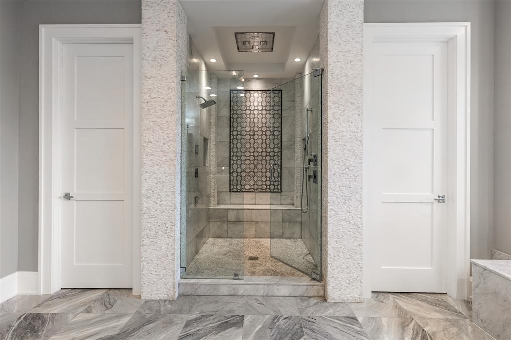 3211 Northeast 27th Avenue Lighthouse Point, FL 33064 - Photo 56 of 98 a bathroom with a glass shower door