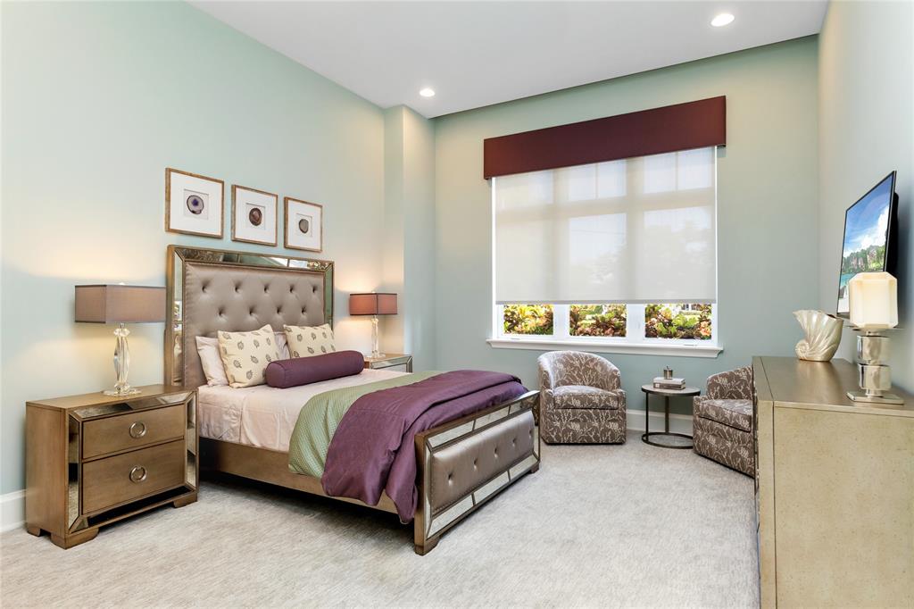 3211 Northeast 27th Avenue Lighthouse Point, FL 33064 - Photo 66 of 98 a bedroom with a bed and a window