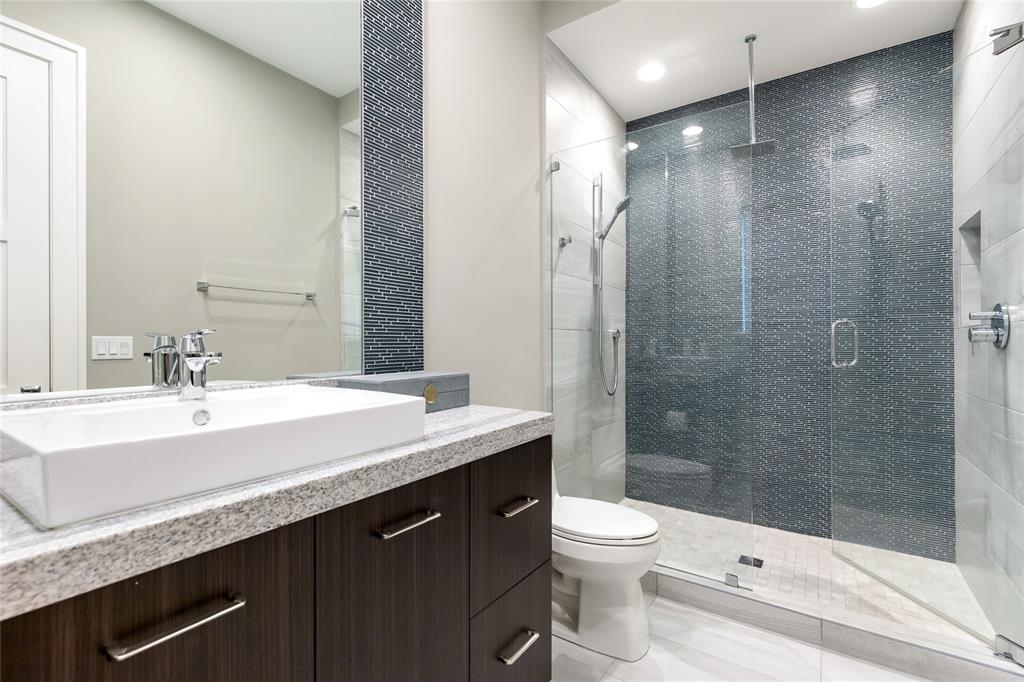 3211 Northeast 27th Avenue Lighthouse Point, FL 33064 - Photo 69 of 98 a bathroom with a sink a toilet and shower