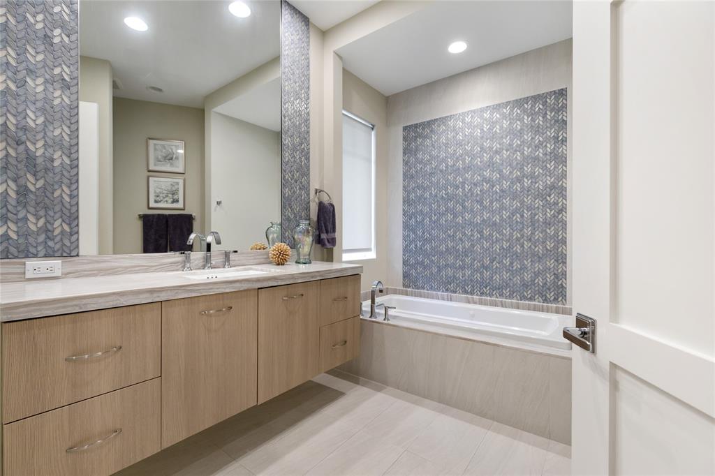 3211 Northeast 27th Avenue Lighthouse Point, FL 33064 - Photo 71 of 98 a bathroom with a bathtub and a sink