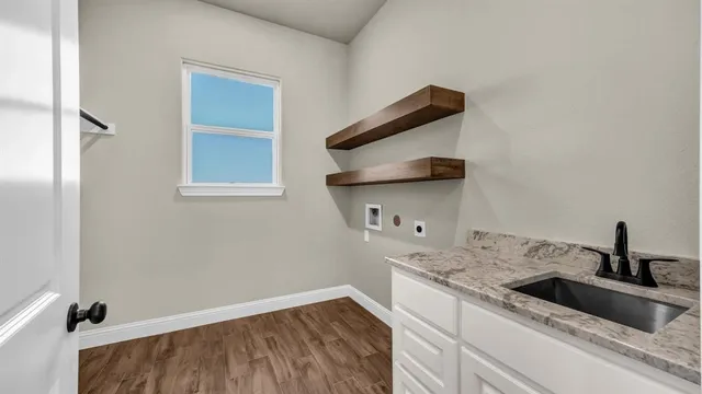 a kitchen with a sink and a window