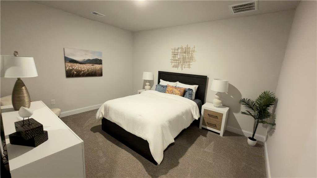 620 Bald Ridge Circle Demorest, GA 30535 - Photo 35 of 43 a bedroom with a bed and a potted plant