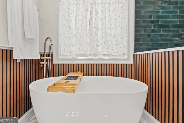 a bathroom with double sink and a mirror