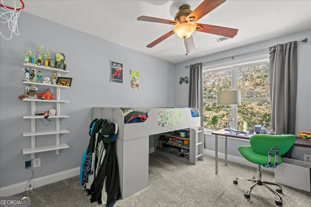 a bedroom with furniture and a window