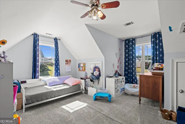 a bed room with furniture and a window