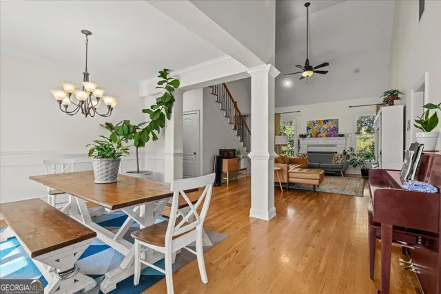a view of a dining room with furniture and chandelier