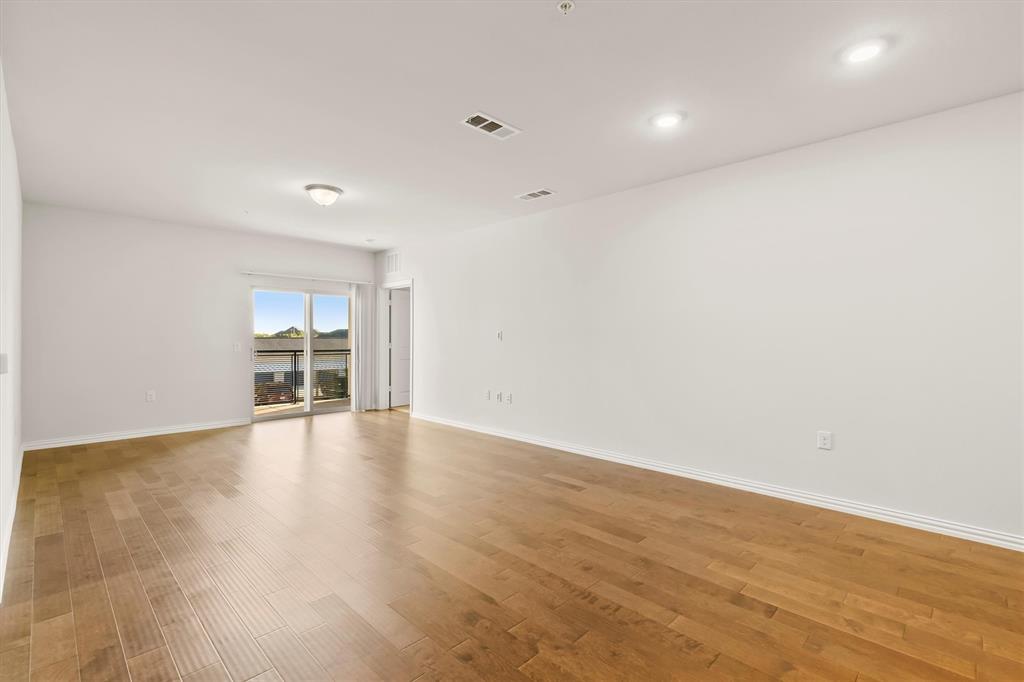 651 Watters Road, Unit 7202 Allen, TX 75013 - Photo 5 of 33 a view of empty room with wooden floor