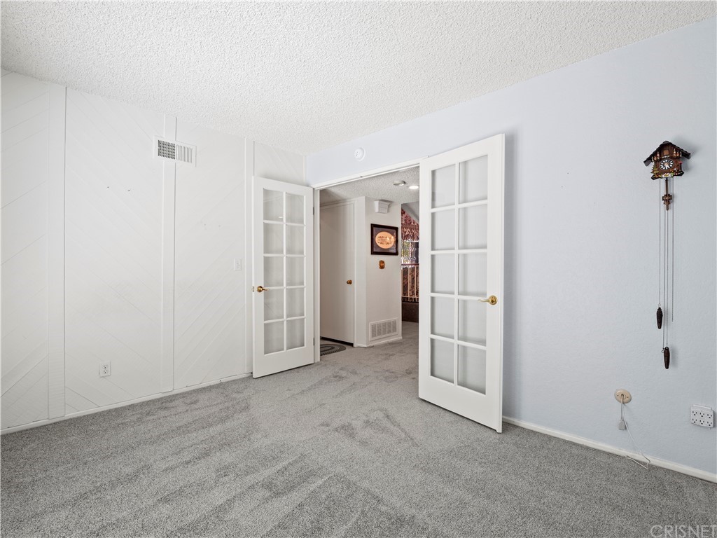 25656 Yucca Valley Road Valencia, CA 91355 - Photo 24 of 49 Double french doors into downstairs bedroom