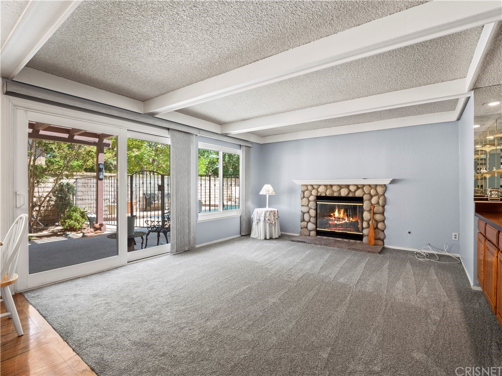 25656 Yucca Valley Road Valencia, CA 91355 - Photo 10 of 49 Family room has beam ceilings and looks out to back yard