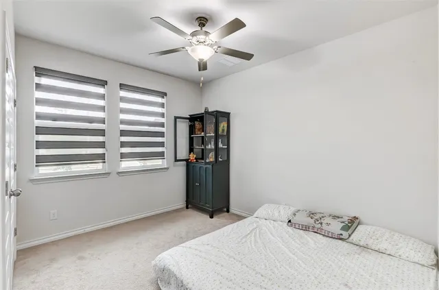a kitchen with sink a counter and chairs