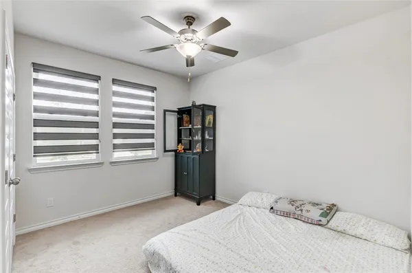 a kitchen with sink a counter and chairs