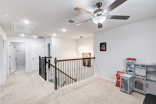 a bathroom with a sink a toilet and shower curtain