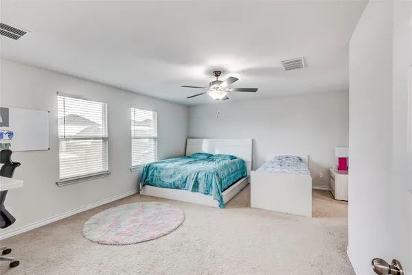 a view of a livingroom with a kitchen