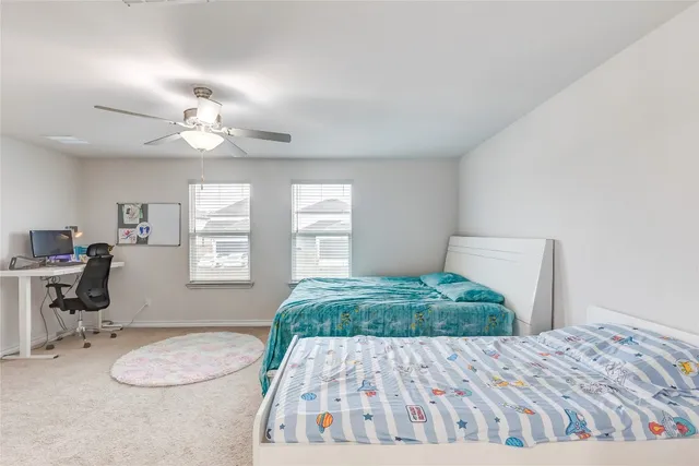 a bedroom with bed and window