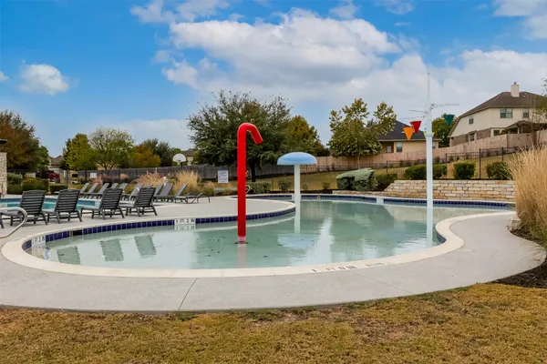 a view of a swimming pool with a patio