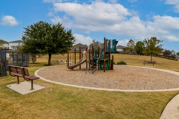 a swimming pool with outdoor seating and yard