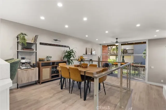 a kitchen with stainless steel appliances a sink a stove a refrigerator and cabinets