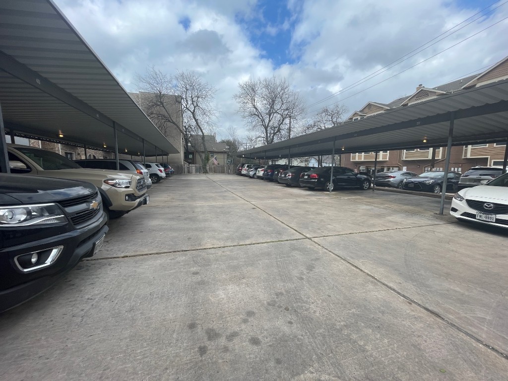 2801 Rio Grande Street, Unit 303 Austin, TX 78705 - Photo 2 of 11 a view of parking garage with cars