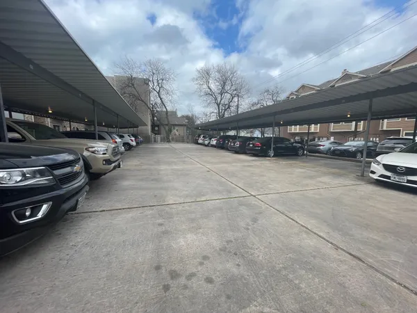 a view of parking garage with cars