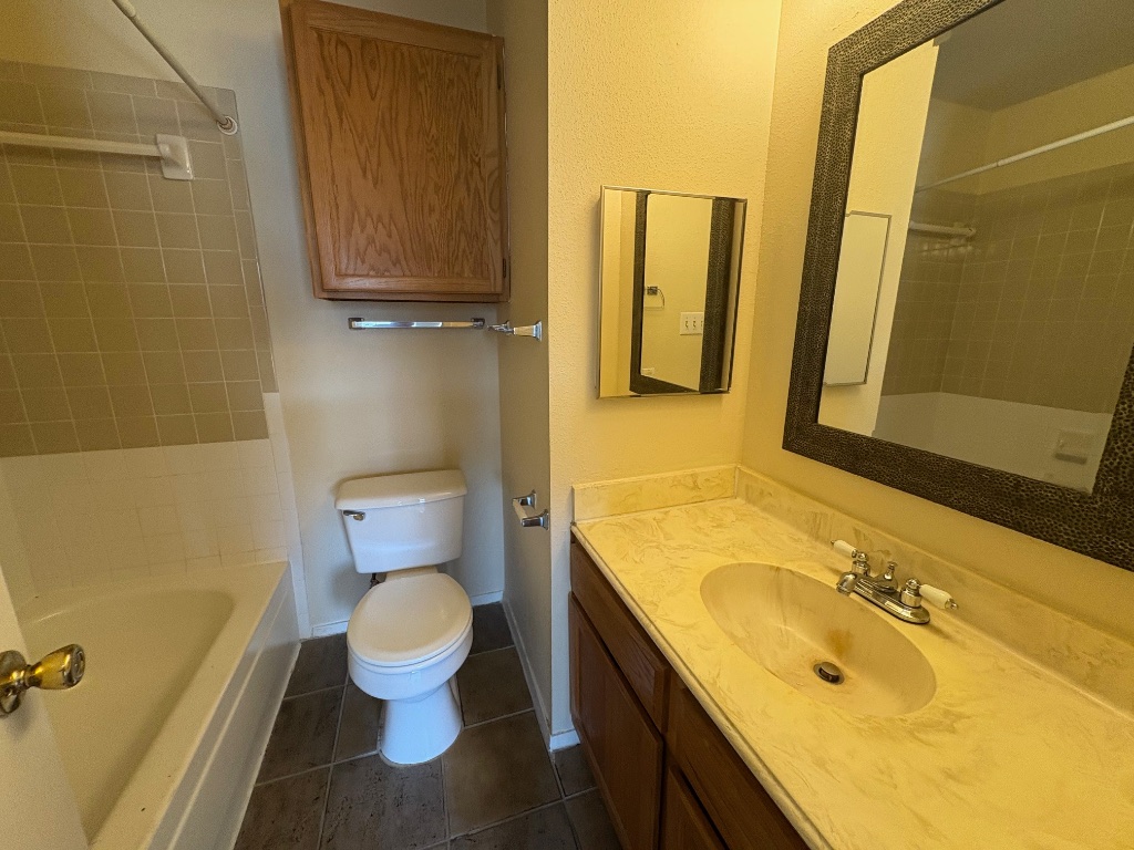 2801 Rio Grande Street, Unit 303 Austin, TX 78705 - Photo 9 of 11 a bathroom with a sink and a toilet