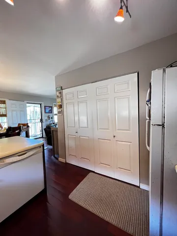 a bedroom with furniture and a wooden floor