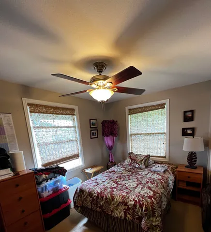 a living room with furniture window and wooden floor