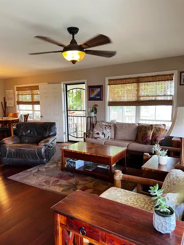 a living room with furniture and a large window