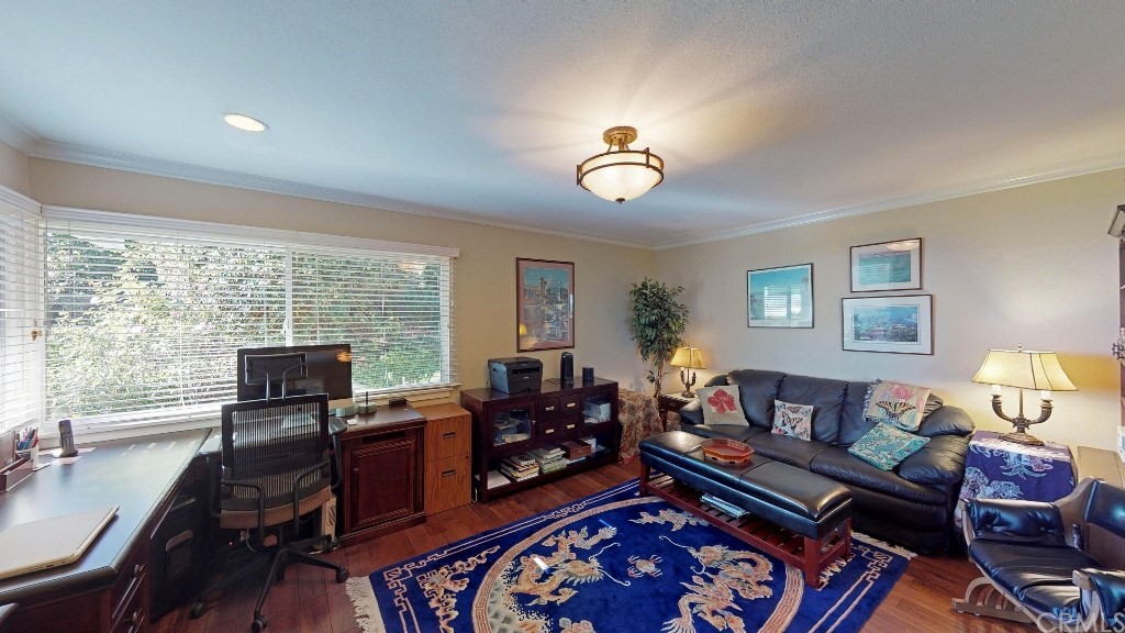 119 Monarch Bay Drive Dana Point, CA 92629 - Photo 12 of 24 a living room with furniture fireplace and a large window