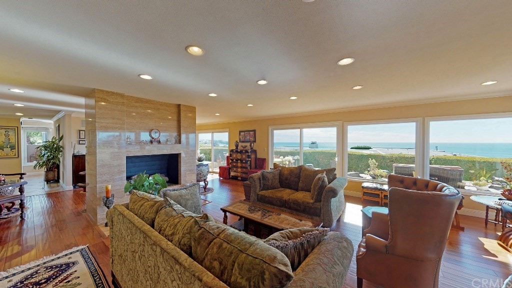 119 Monarch Bay Drive Dana Point, CA 92629 - Photo 14 of 24 a living room with furniture fireplace and a large window