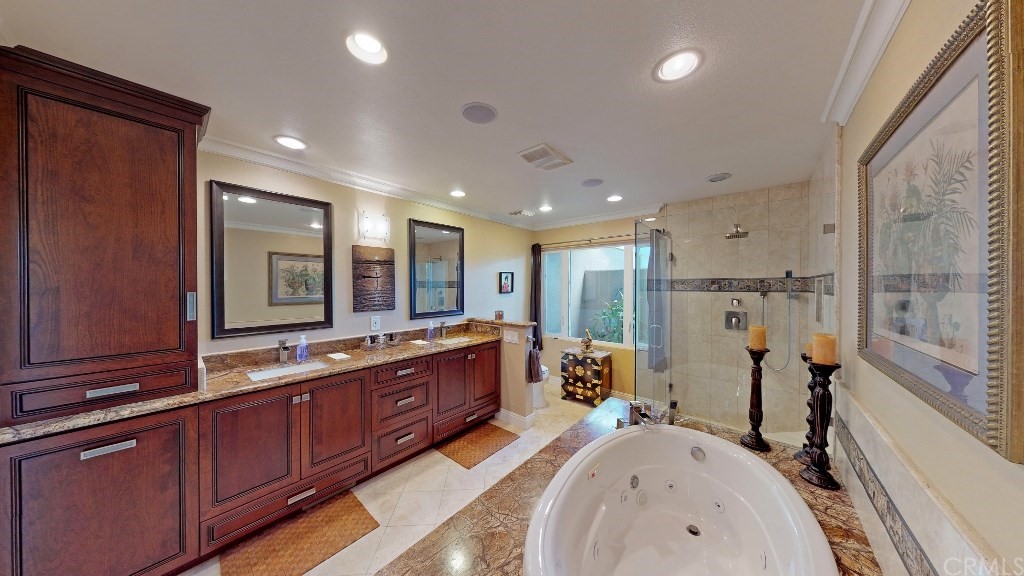 119 Monarch Bay Drive Dana Point, CA 92629 - Photo 4 of 24 a large bathroom with double vanity a bathtub and a shower