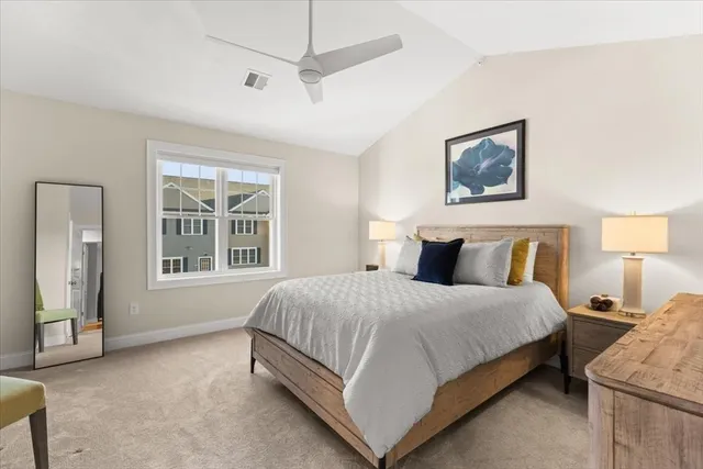 a bedroom with bed and window