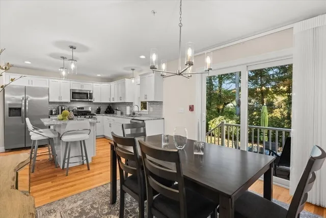a view of a dining room with furniture window and outside view