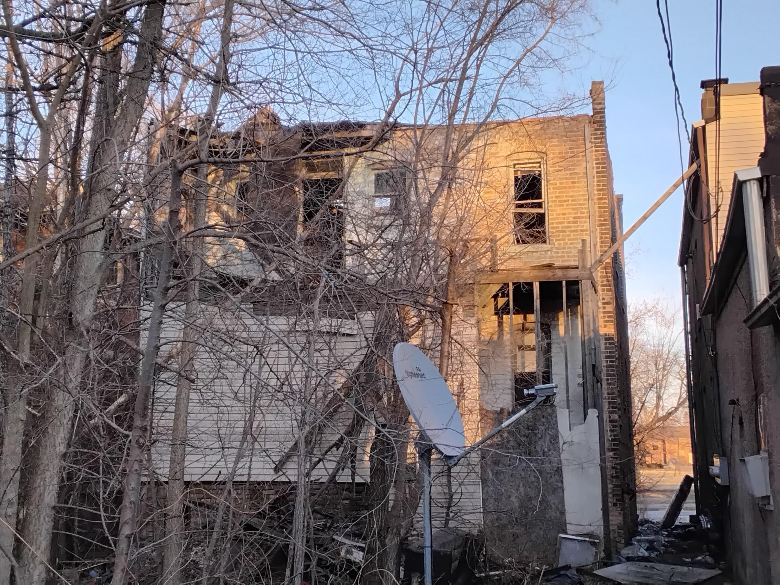 1400 Jackson Street Gary, IN 46407 - Photo 2 of 3 a front view of a house with a yard