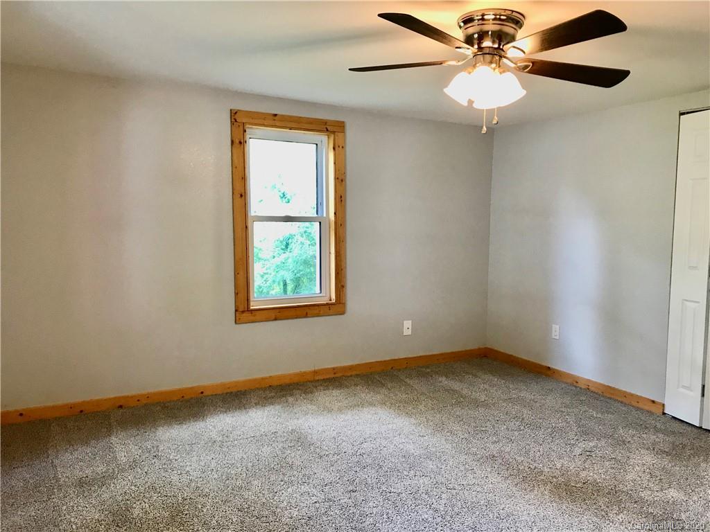 684 Holtzclaw Road Canton, NC 28716 - Photo 2 of 33 a view of an empty room with a window