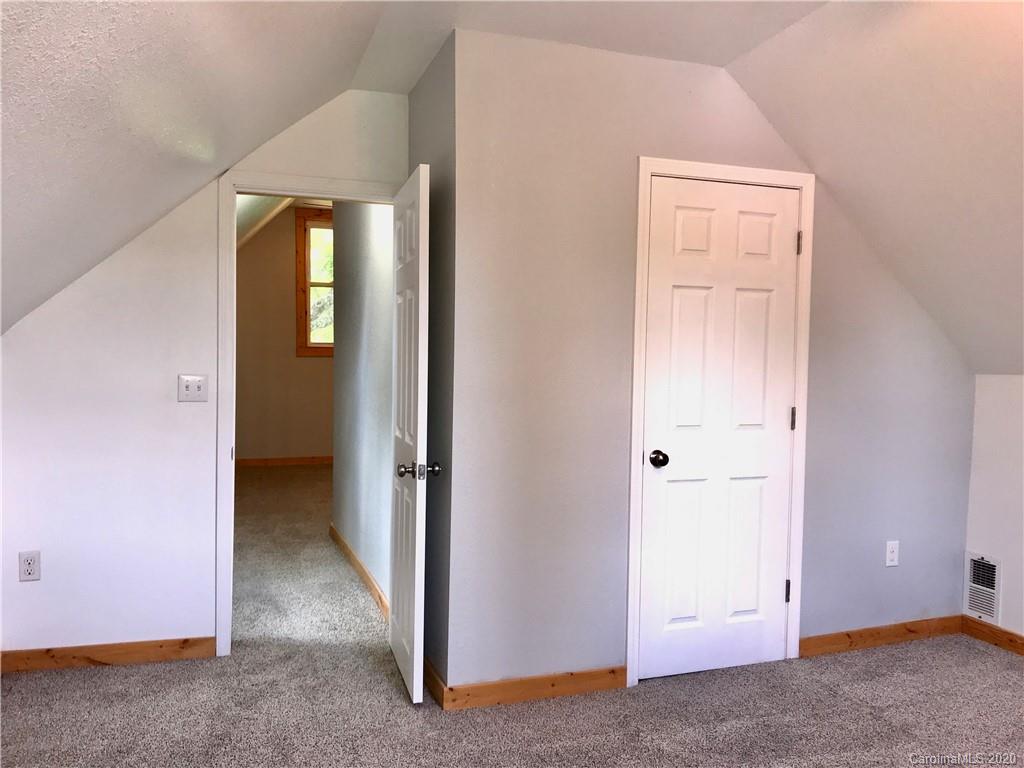 684 Holtzclaw Road Canton, NC 28716 - Photo 20 of 33 an empty room with windows and closet