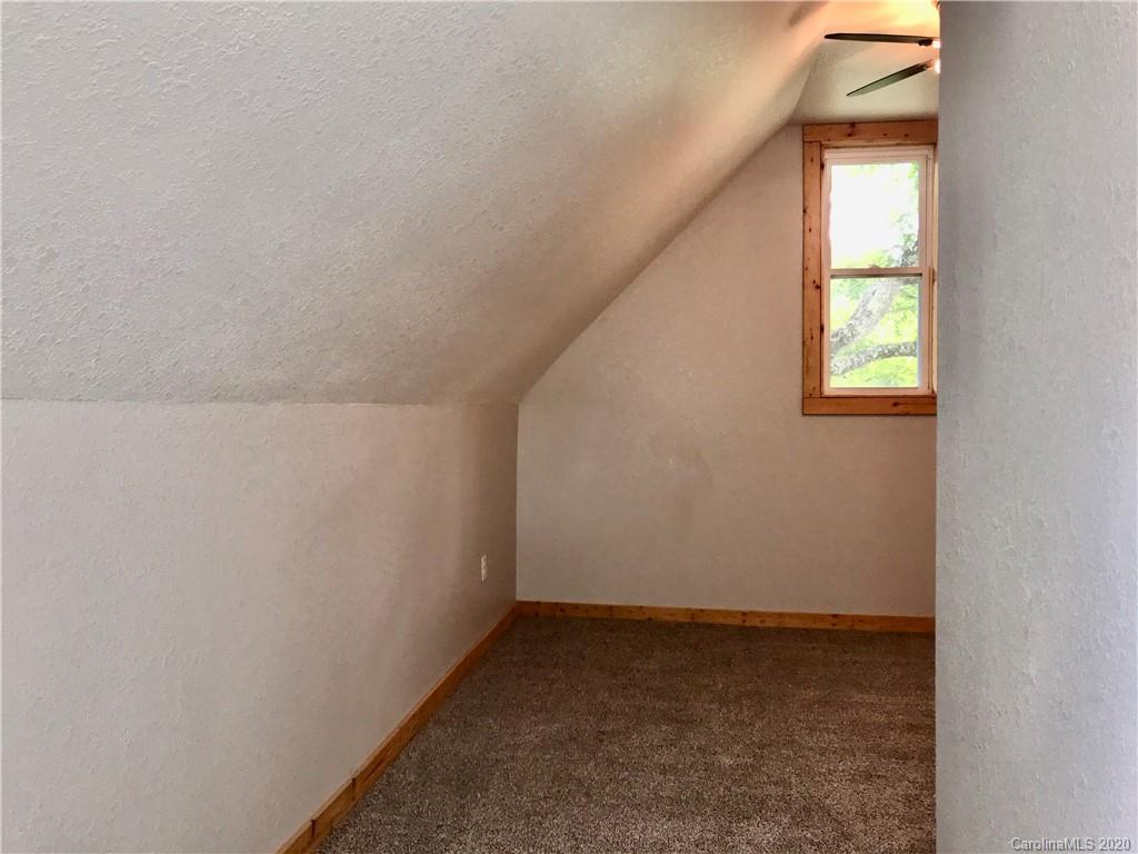 684 Holtzclaw Road Canton, NC 28716 - Photo 21 of 33 a view of an empty room and window