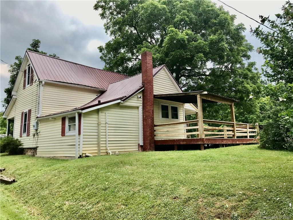 684 Holtzclaw Road Canton, NC 28716 - Photo 28 of 33 a front view of a house with a garden