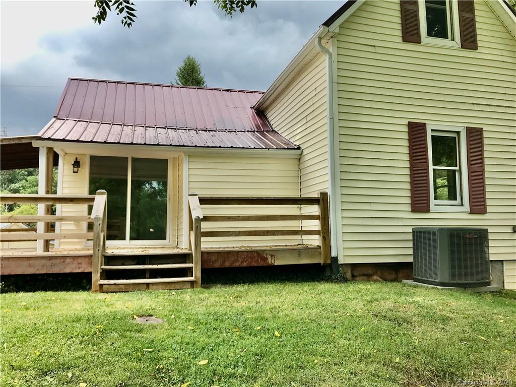 684 Holtzclaw Road Canton, NC 28716 - Photo 30 of 33 a view of a house with a back yard