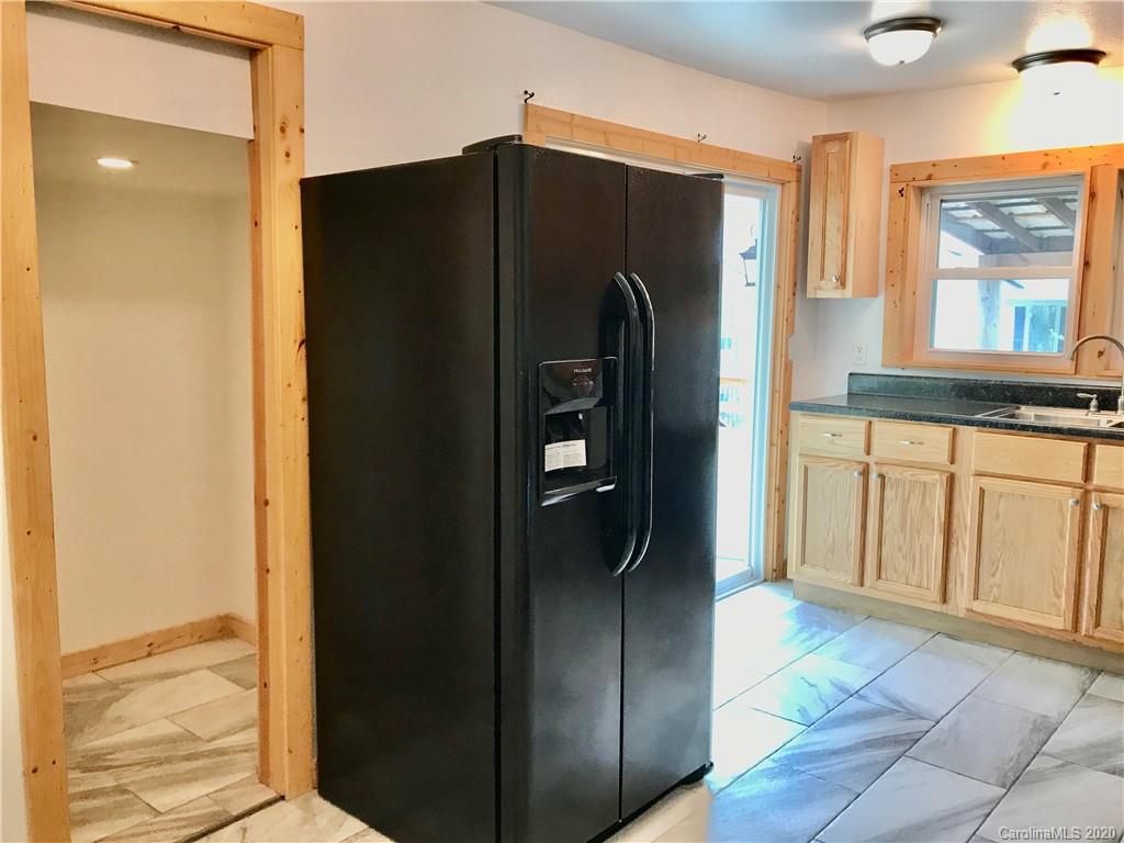 684 Holtzclaw Road Canton, NC 28716 - Photo 10 of 33 a kitchen with stainless steel appliances granite countertop a refrigerator and a granite counter tops