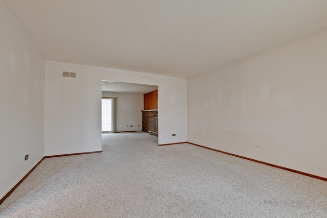 601 West Golf Road Libertyville, IL 60048 - Photo 5 of 27 an empty room with a empty space and windows