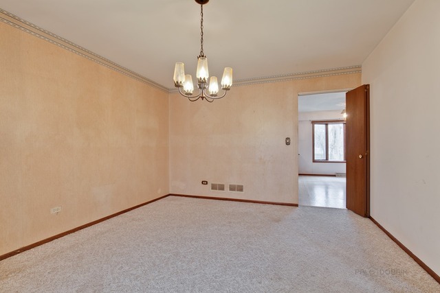 601 West Golf Road Libertyville, IL 60048 - Photo 6 of 27 a view of empty room with chandelier
