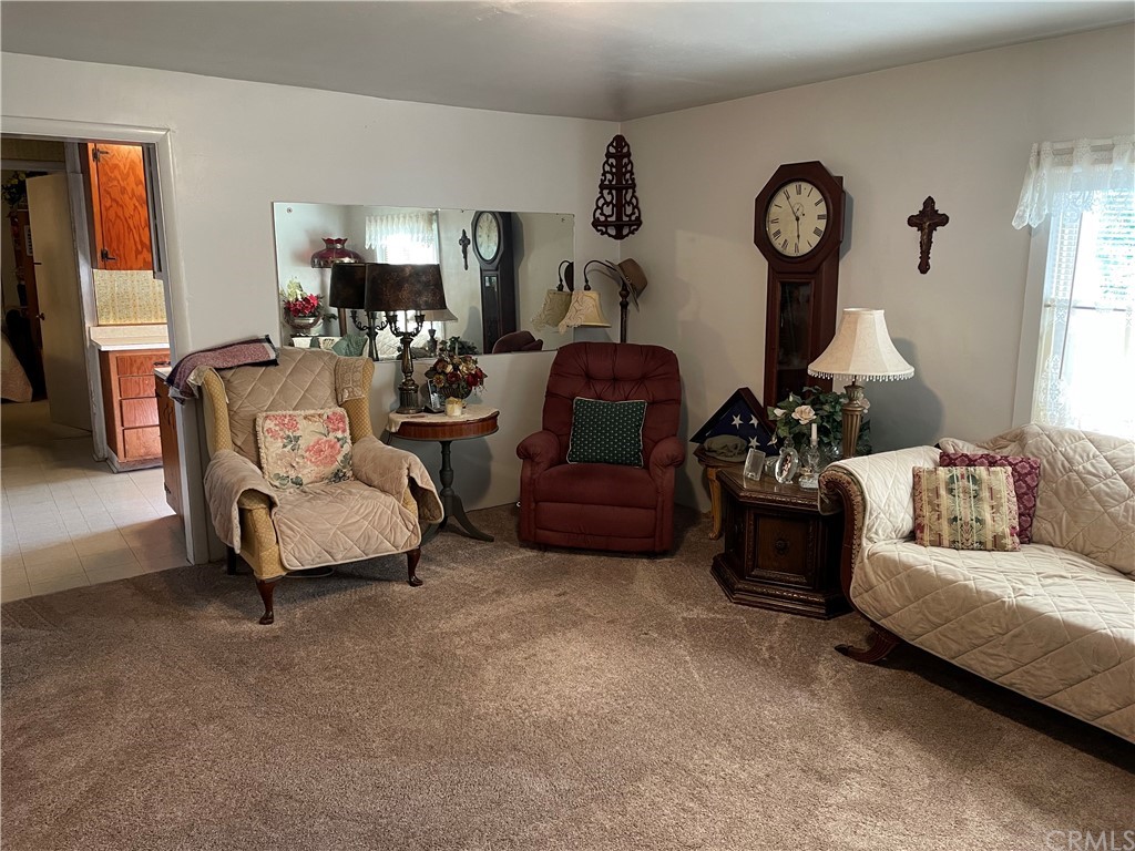 8485 Morro Road Atascadero, CA 93422 - Photo 8 of 36 a living room with furniture a large window and a fireplace